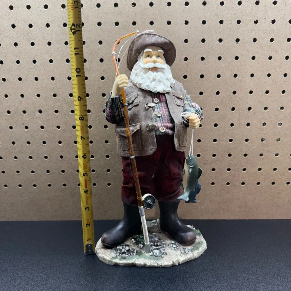 Christmas 2005 Santa fishing figurine holding a fishing pole and fish plastic